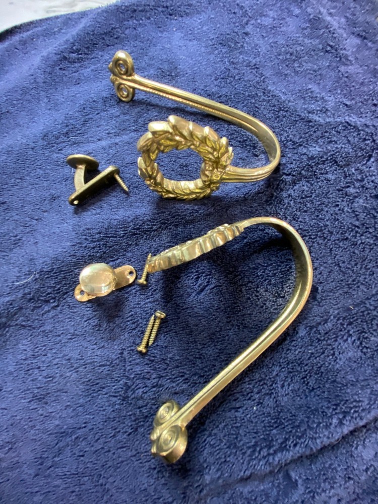 Ornate vintage brass drape tie-backs.