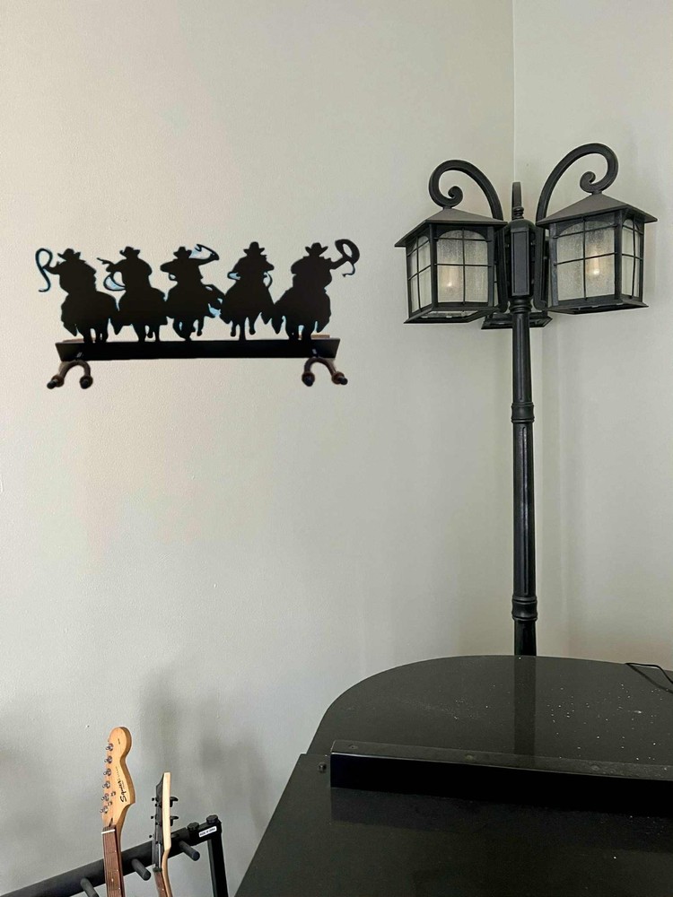 Guitar hanger for two. Cowboys