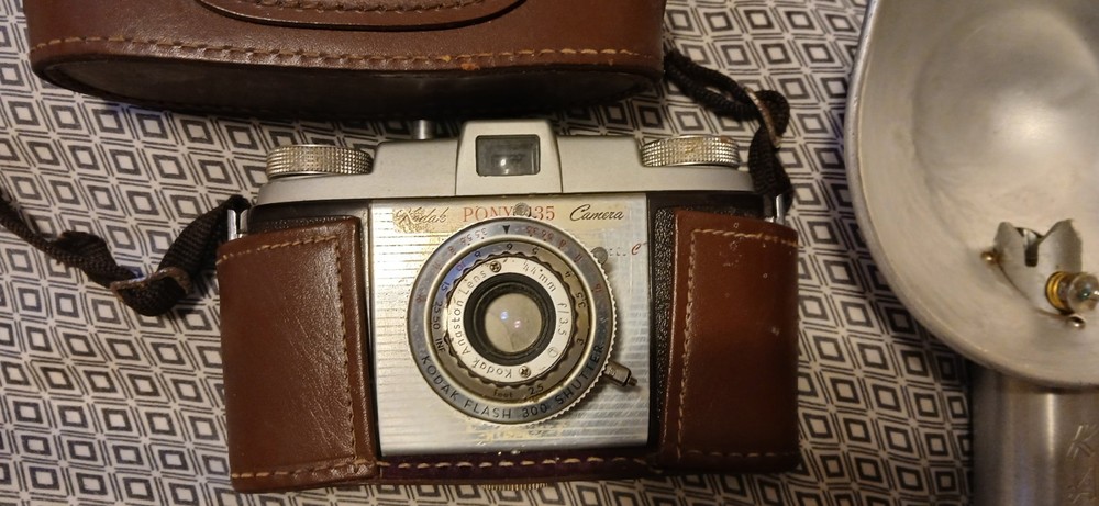 Vintage Camera,Lens, And Flash Bulb.