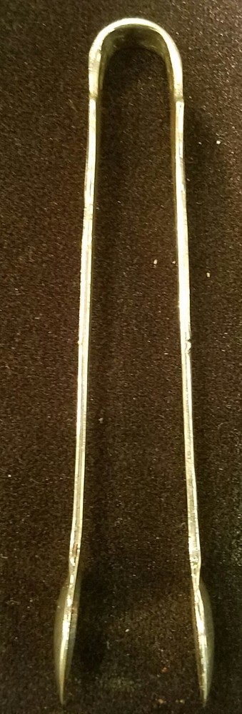 Silver spoon tongs