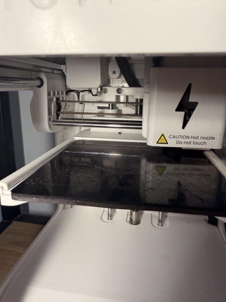 toybox 3d printer alpha 2 with power cable and accessories.