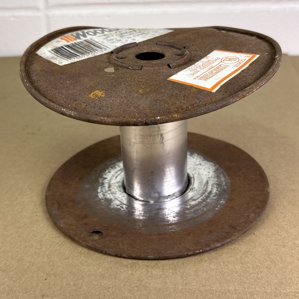 Empty Metal Woods Wire Spool Rusted and Bent Slightly