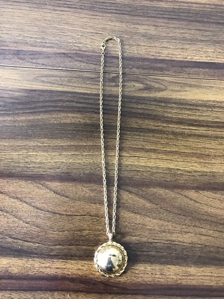 Monet Gold tone Necklace with round Pattern Pendant