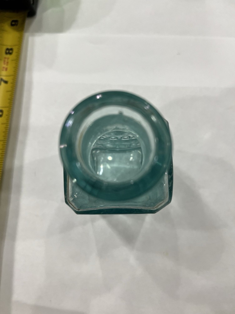 Embossed Aqua Kavu Boot Polish Bottle