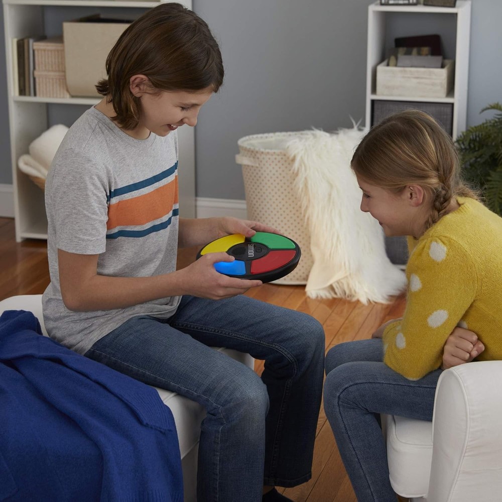Hasbro Gaming Simon Handheld Electronic Memory Game With Lights and Sounds...