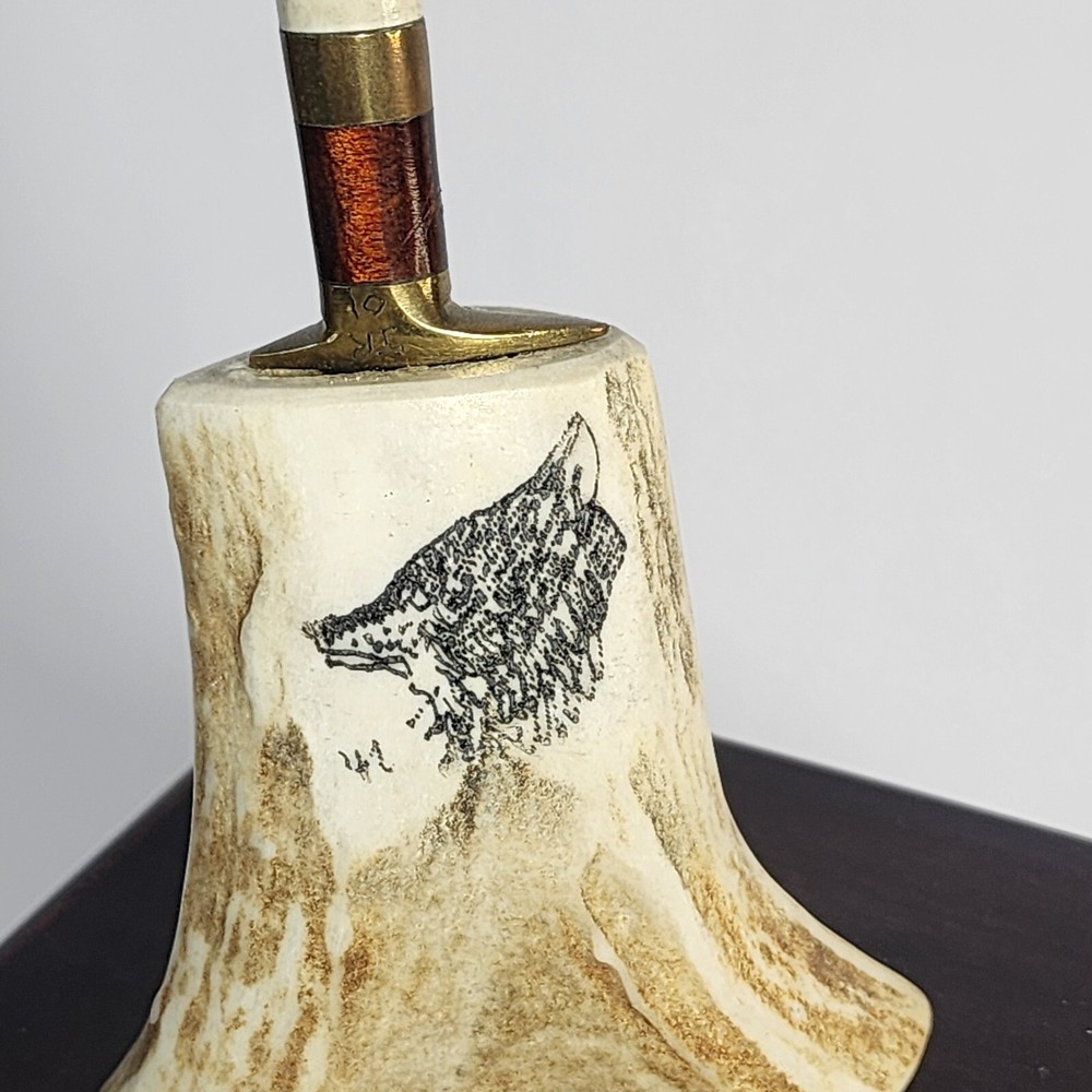Small Knife In Bone looking Holder With Wolf On