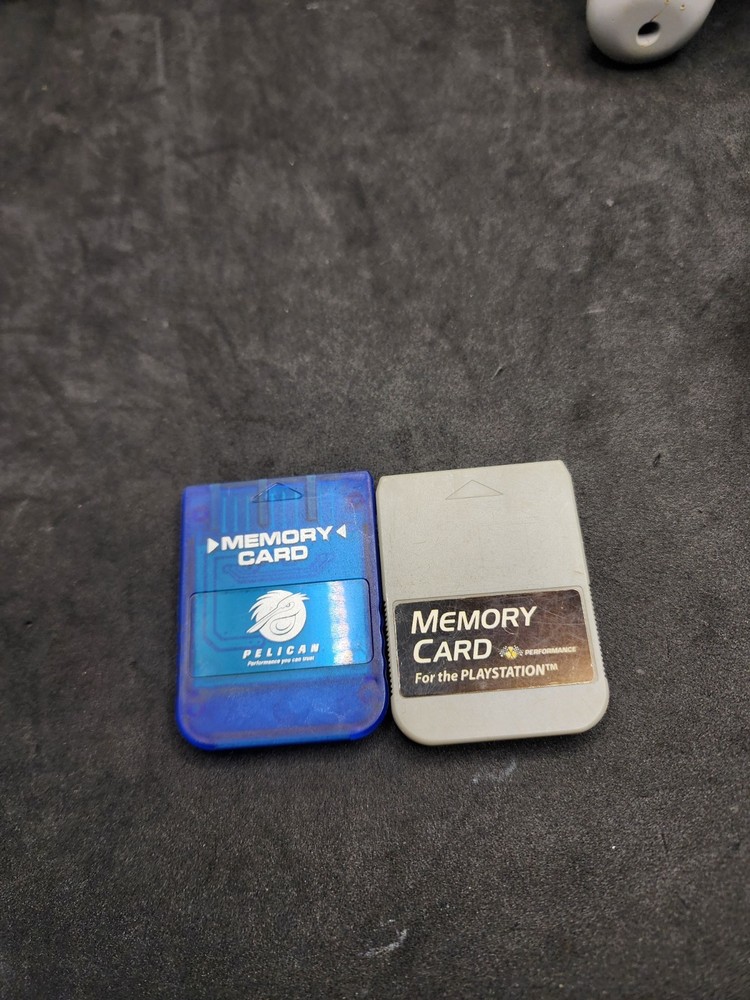 2 Playstation Controllers And 2 Memory Cards