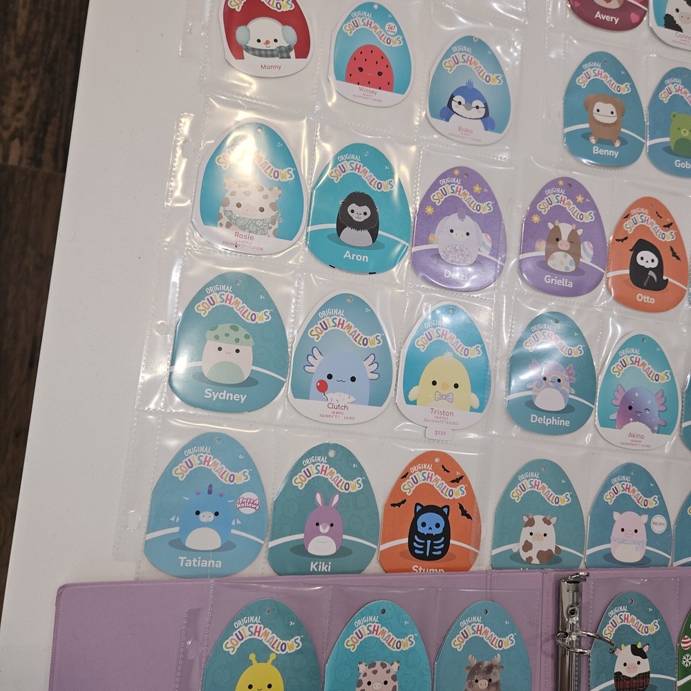 71 Squishmellow Tags In Binder. TAGS ONLY