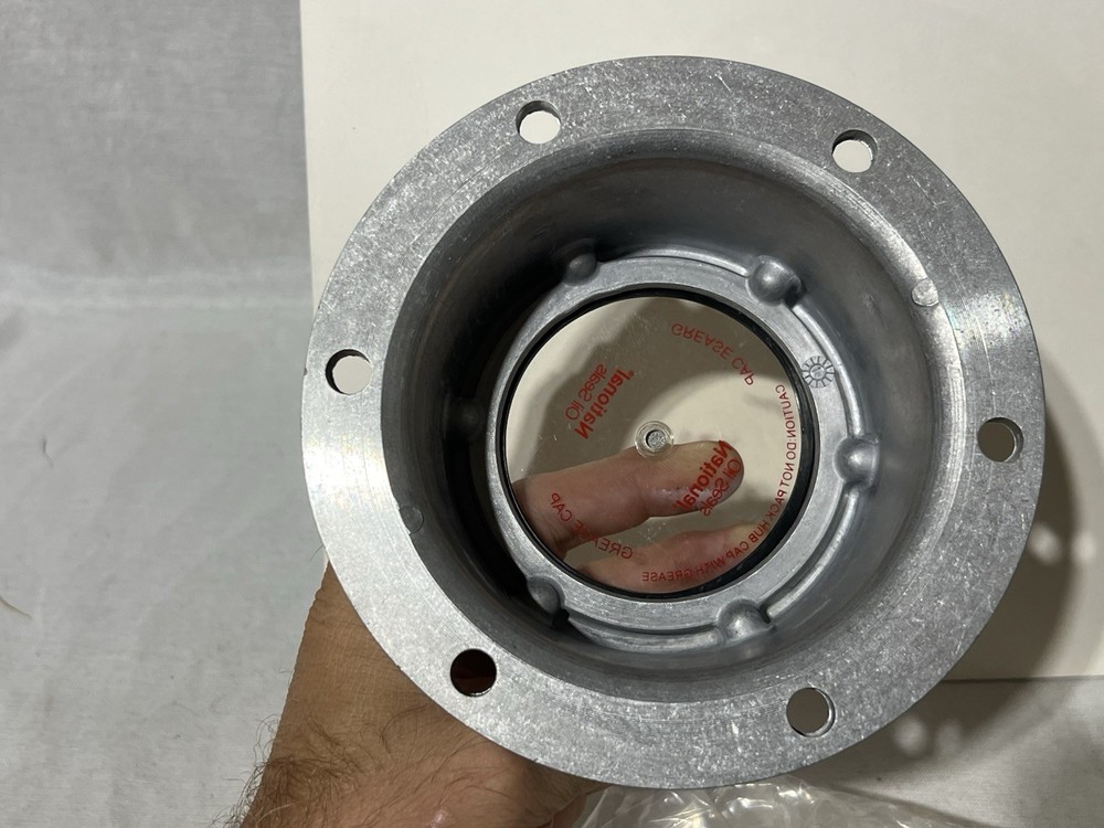 National Axle hubcap #009A-Grease Pack Style