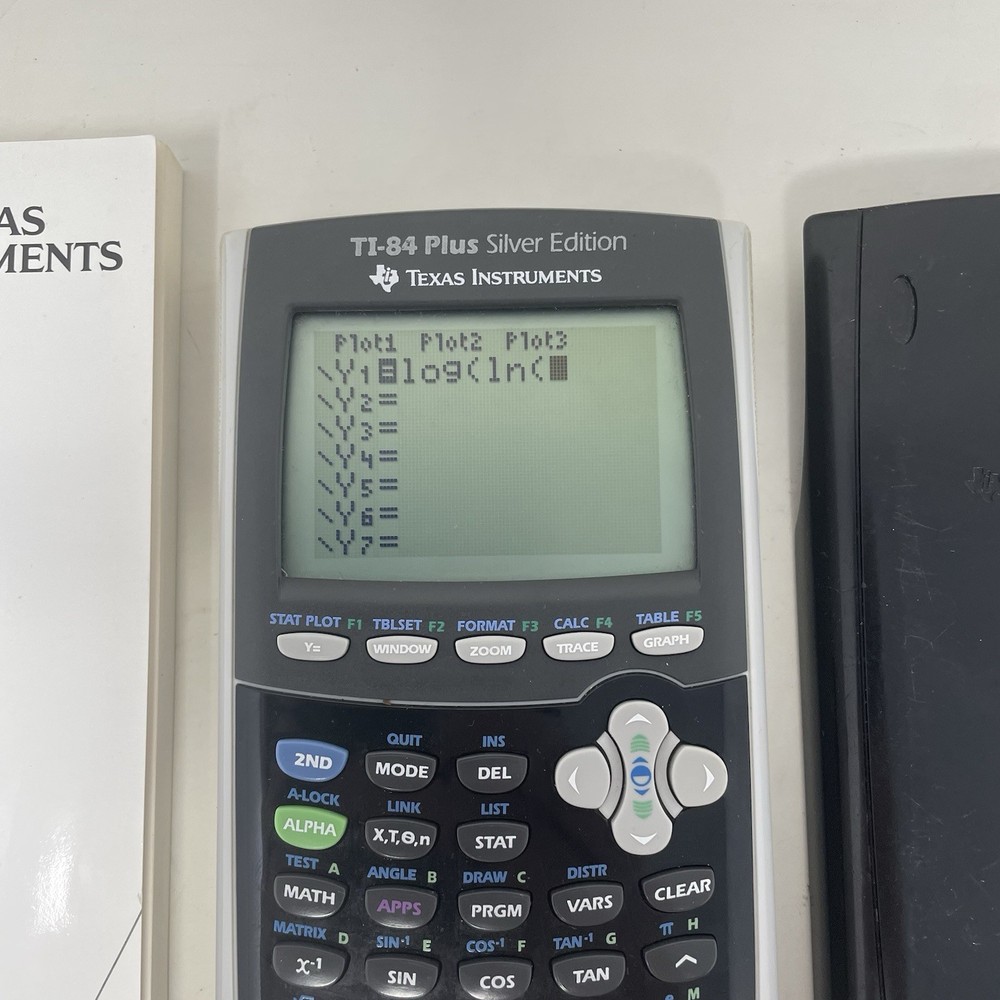 Texas Instruments TI-84+ Plus Silver Edition Graphing Calculator with Manual