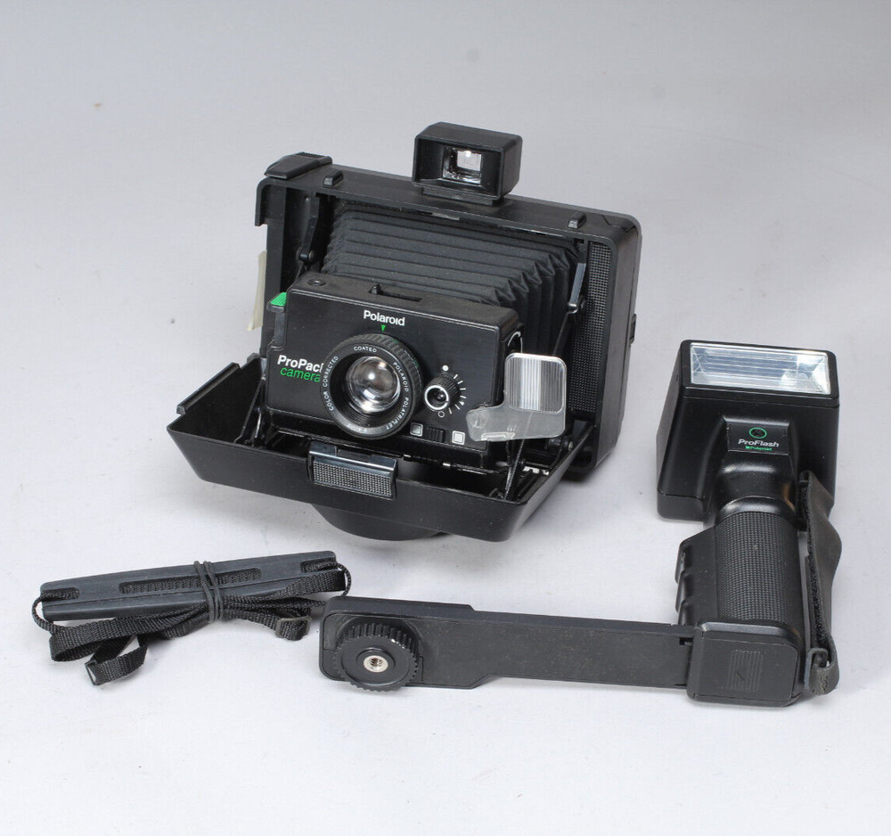 POLAROID PRO-PACK IN THE BOX W CAMERA FLASH STRAP & MANUALS FLASH BAD