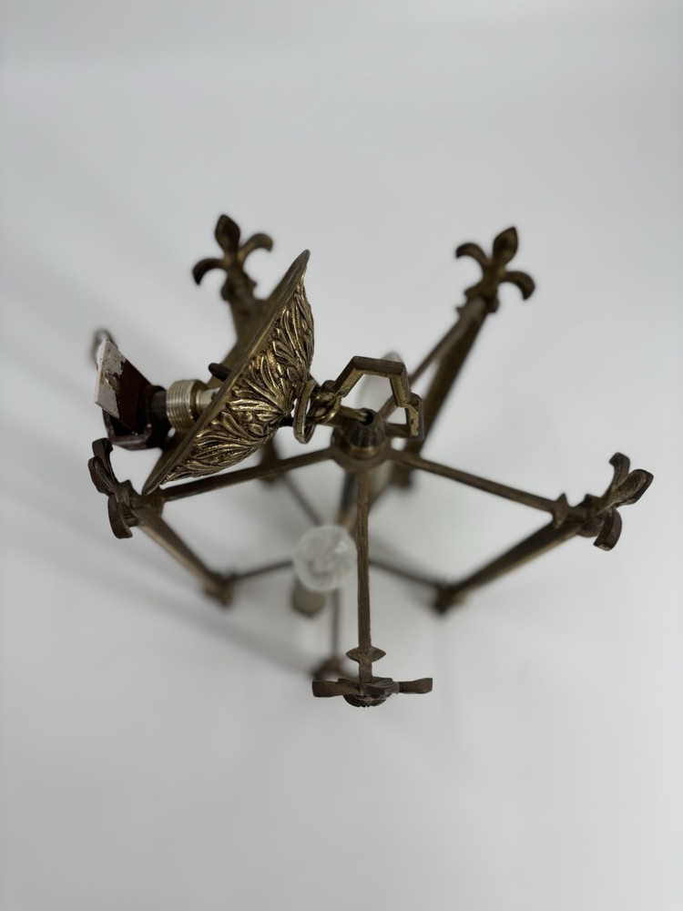 This is an antique lantern chandelier featuring fleur-de-lis finials.