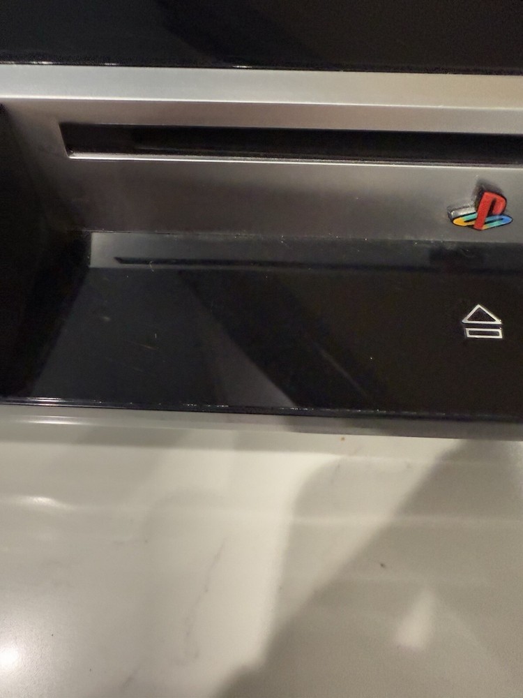 Sony PlayStation 3 with Controller, Power Cord, And Remote