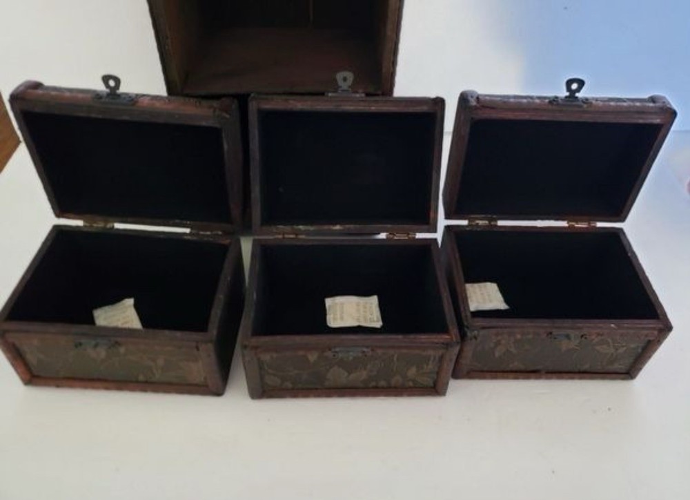 3 Small Storage Trunks in Shelving Unit