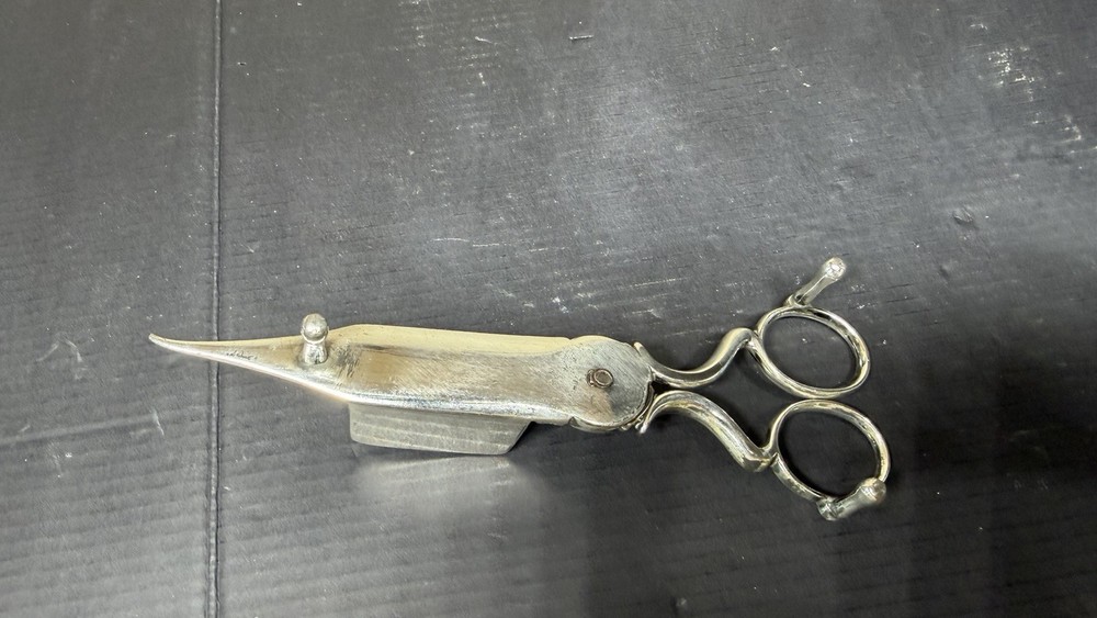 Antique Rogers Candle Snuffer