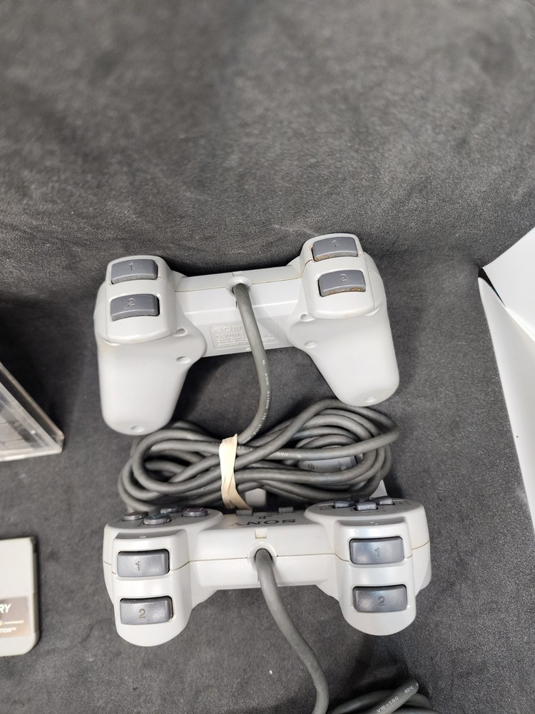 2 Playstation Controllers And 2 Memory Cards