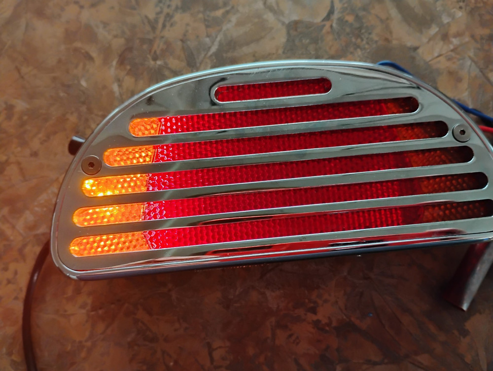 HARLEY NOS CUSTOM BOBTAIL CHROME TAILIGHT WITH DIRECTIONALS IN IT !!!