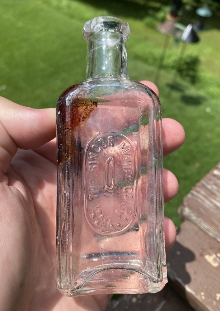 The Singer Sewing Machine Co Bottle