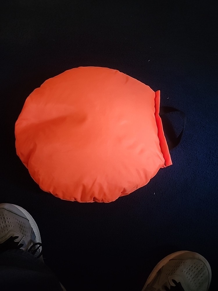 Orange Hunting Seat With Beads In It