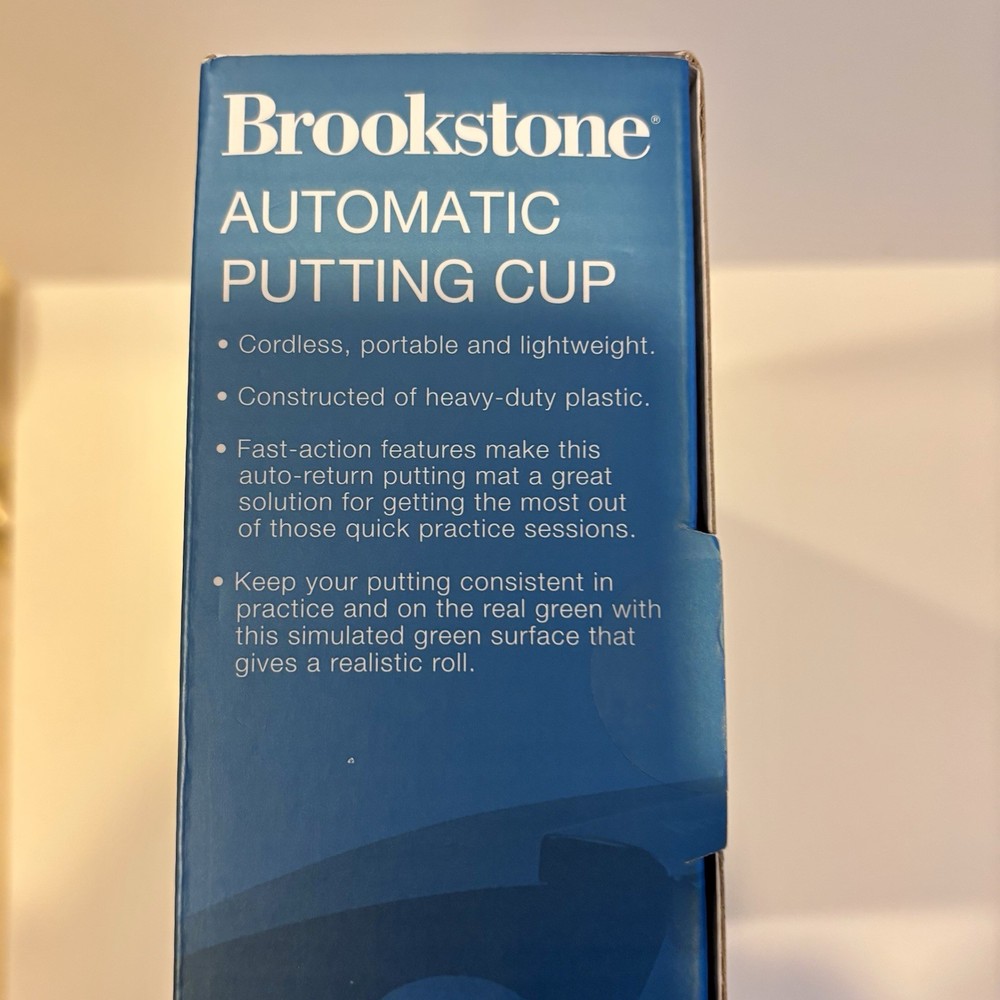 NIP / SEALED Brookstone Automatic Putting Cup Cordless Portable