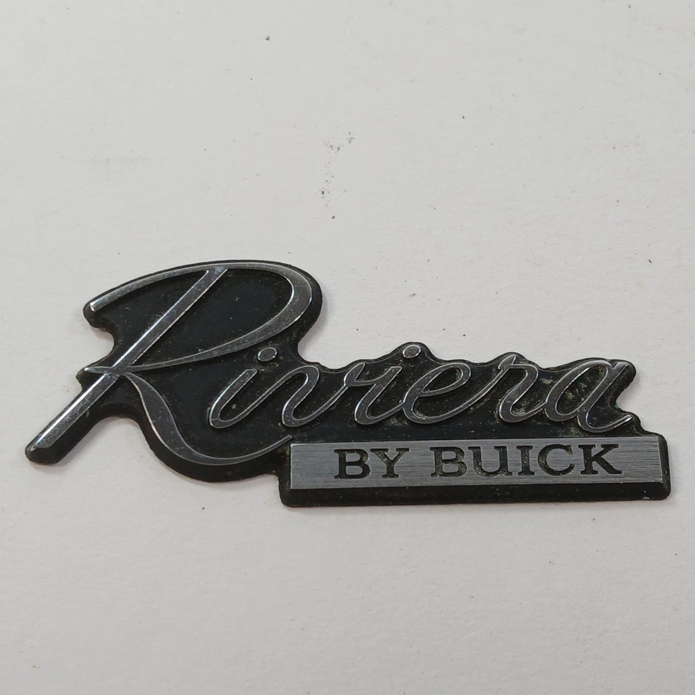 RIVIERA BY BUICK CIRCA '80'S DASH PLASTIC EMBLEM
