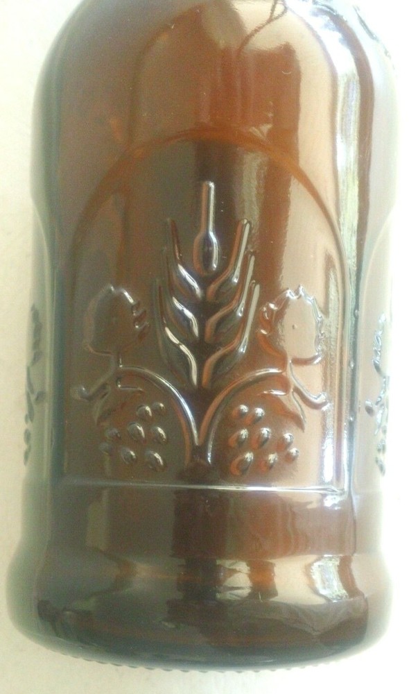 One E-Z Cap Amber 16 Ounce Bottle with Embossed Pattern on Side