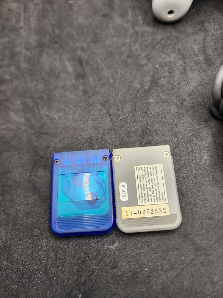 2 Playstation Controllers And 2 Memory Cards