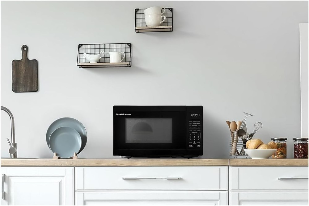 Compact Black Microwave Oven with Timer, Defrost, and 10" Carousel Turntable