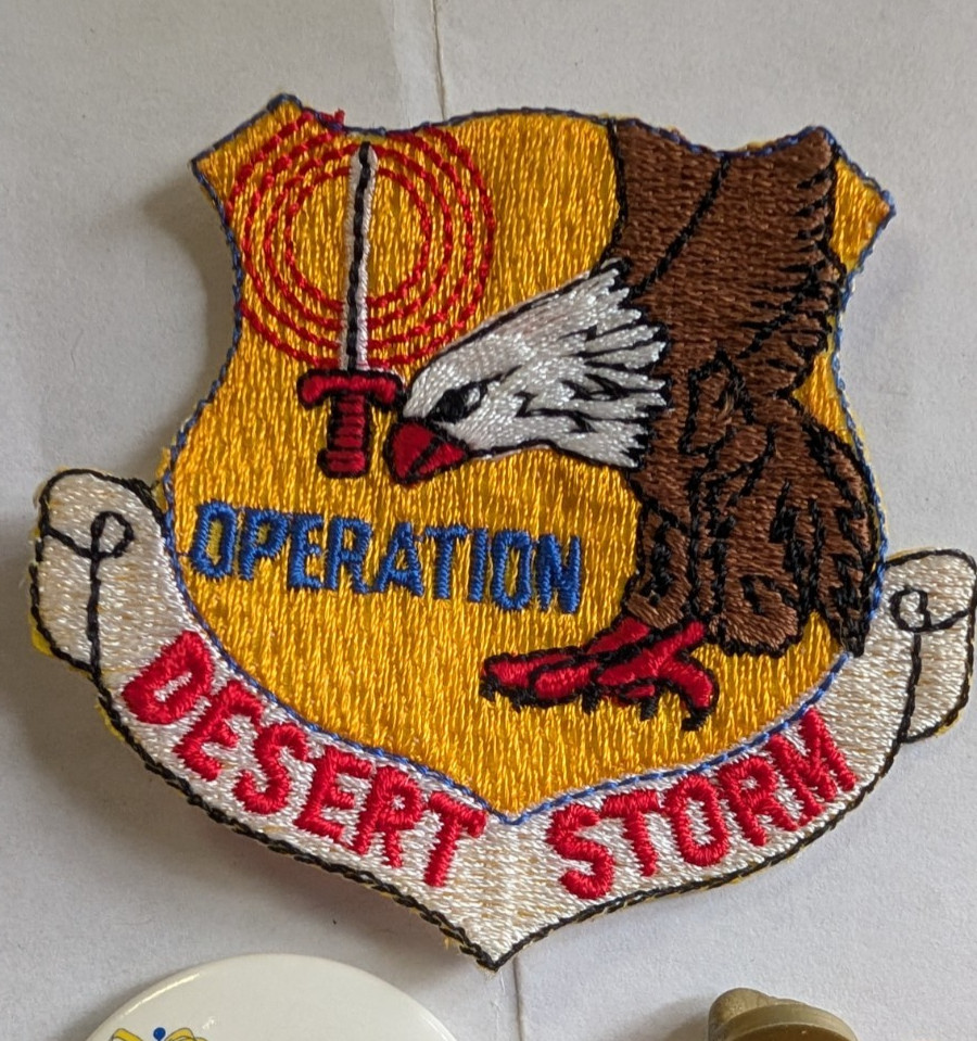 Operation Desert Storm pinback button, yellow ribbon pin, and patch
