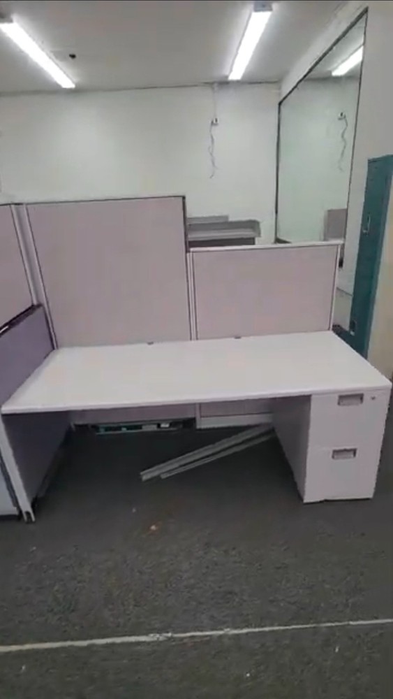Eight used office cubicles and office desk.
