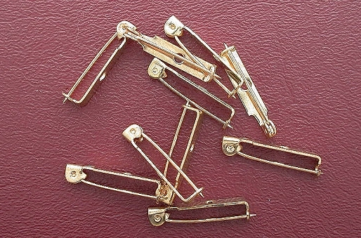 NINE ONE INCH BRASS PIN BARS