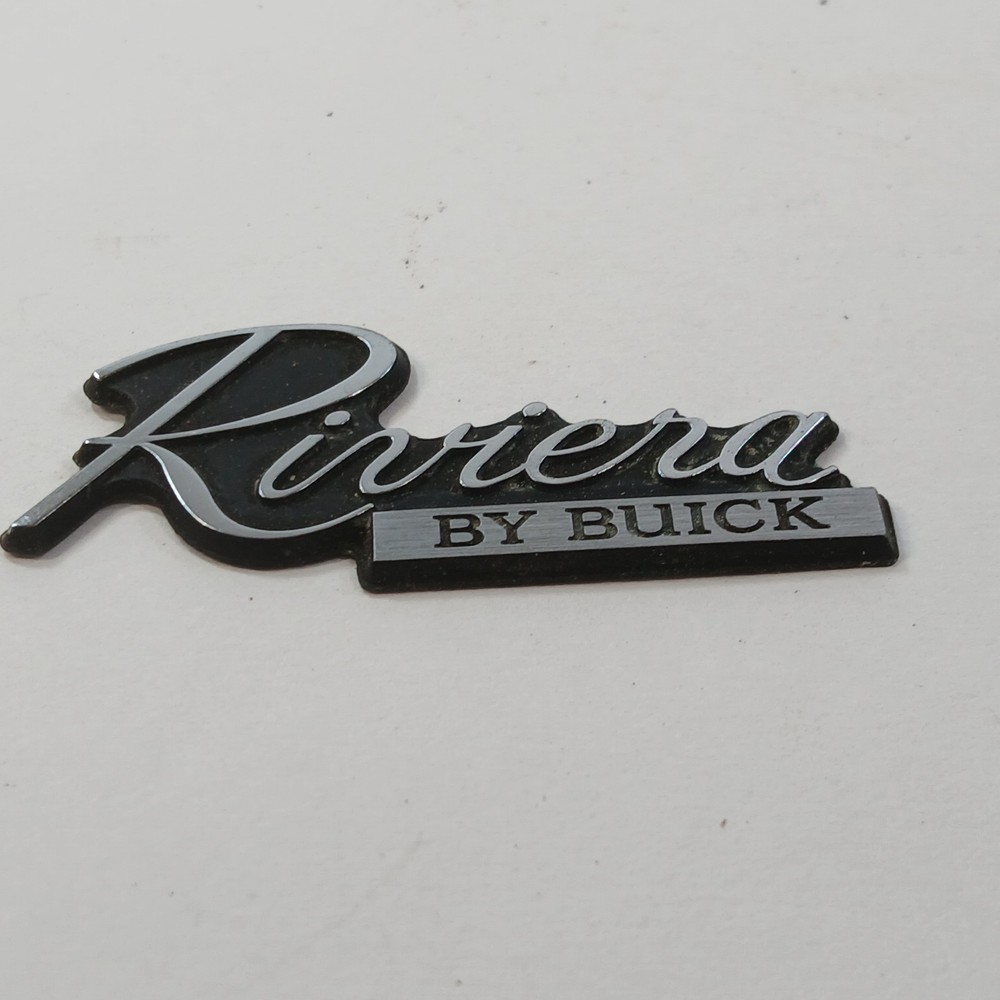 RIVIERA BY BUICK CIRCA '80'S DASH PLASTIC EMBLEM