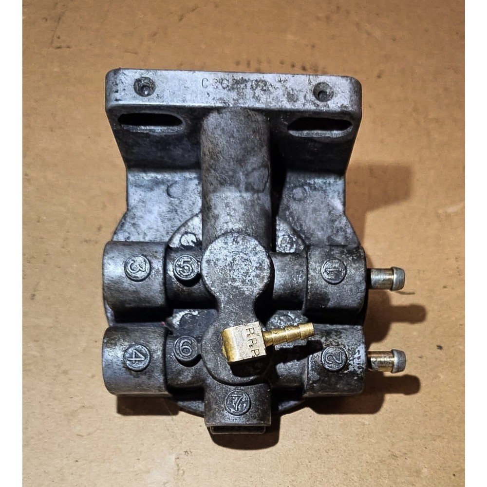 Fuel filter base, 2x 5/16" hose barbs, SAME SIDE (321)