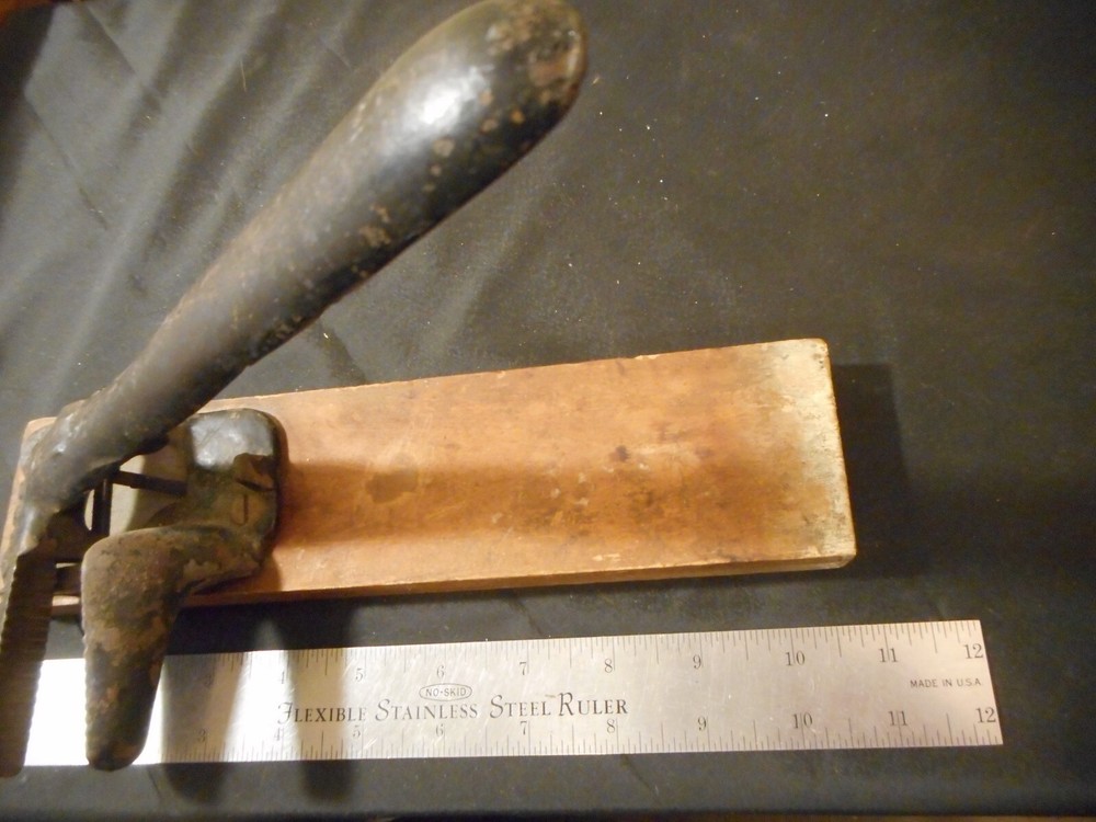 antique Brighton cast iron spring loaded nut cracker marked 10