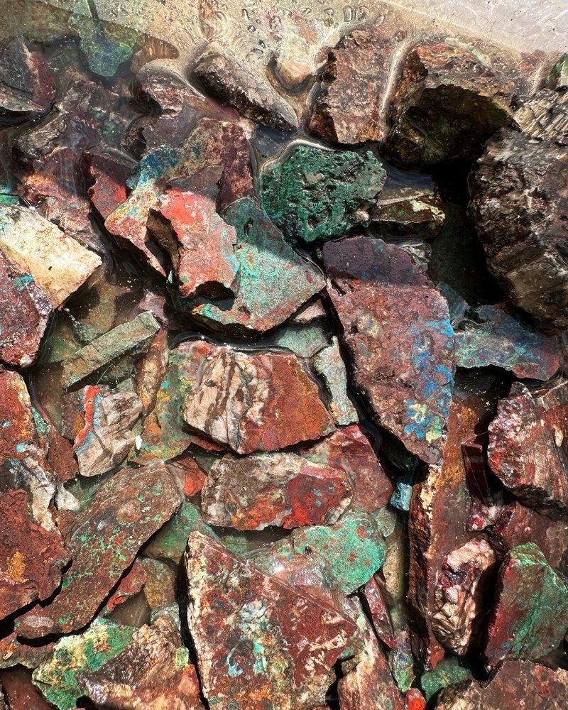 Apache gem Chrysocolla large parcel of slabs and cutter stones.