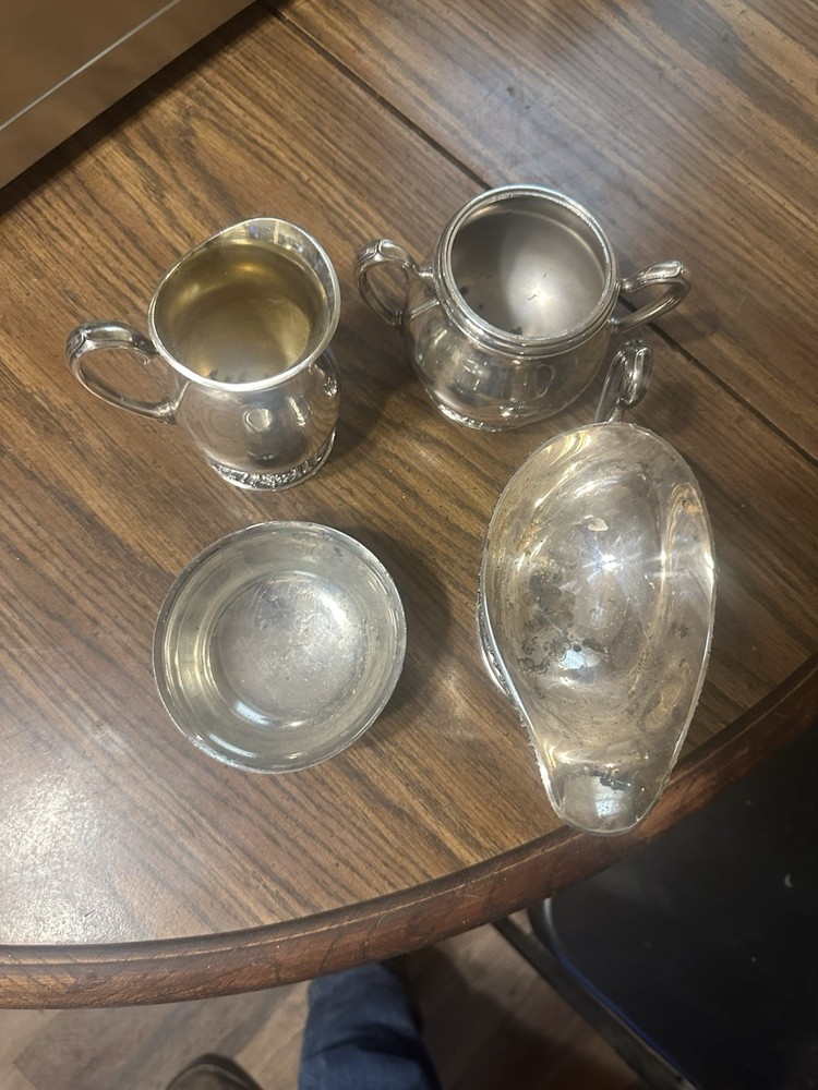 Set Of Four Silver Plated Cups.