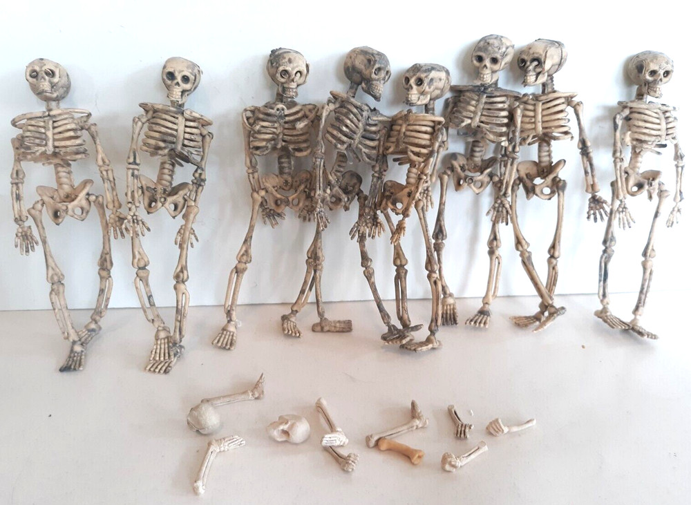 8 plastic skeletons and extra bones 5" tall Halloween