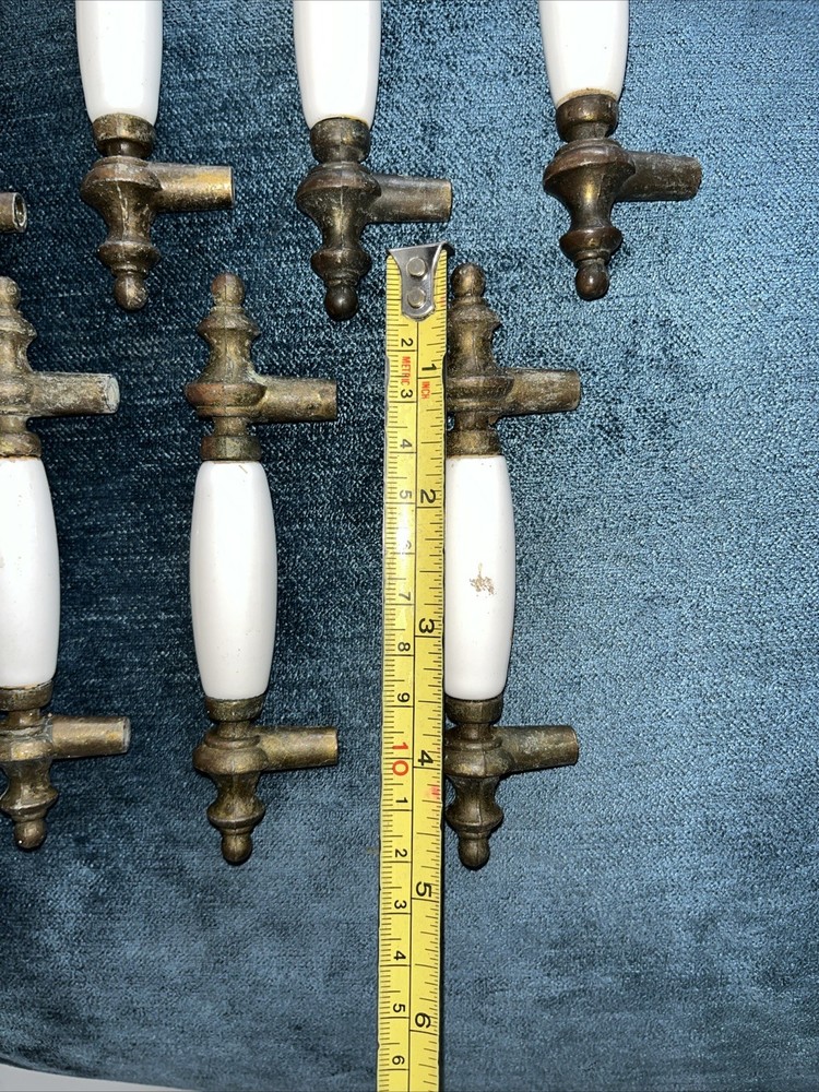 9 vintage brass and porcelain cabinet pull knobs 5” Wide.