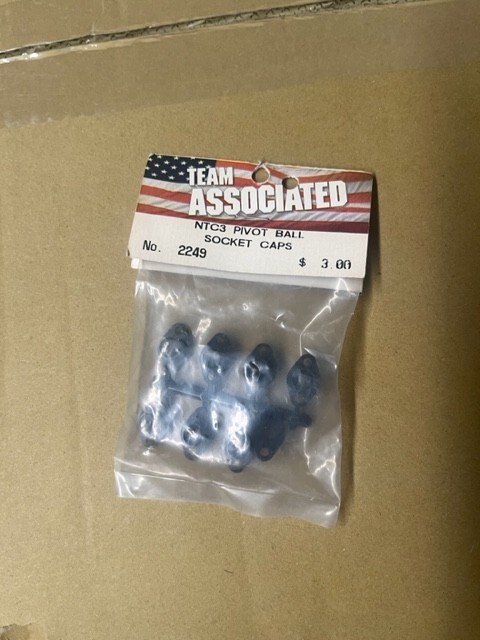Team Associated BUNDLE (2249-pivot ball socket caps) & (9157- servo saver)