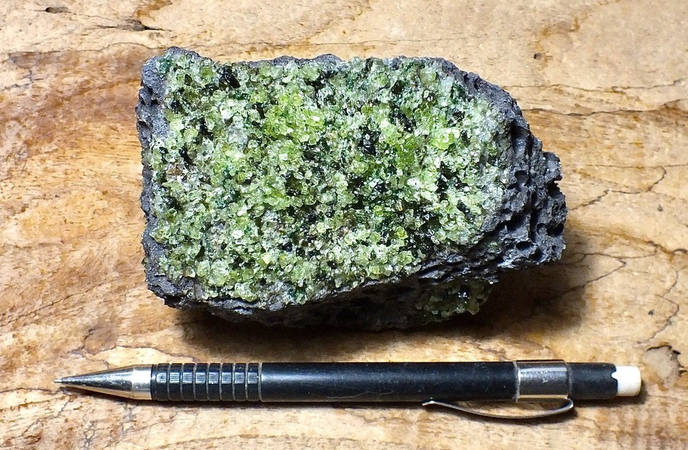 peridotite xenolith in vesicular phonotephrite - hand/display specimen