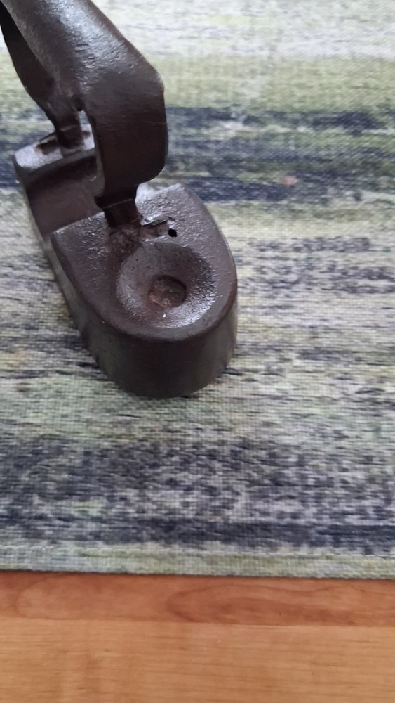 Antique 19th-century cast iron flat iron with a solid handle.