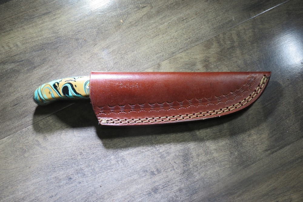 Sleek Damascus knife with multi colored ceramic handle & leather sheath