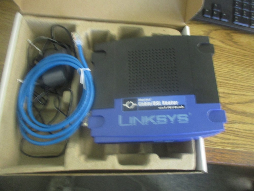 Linksys: BEFSR41 Ethernet Cable/DSL Router with 4-Port Switch. Includes Adptr