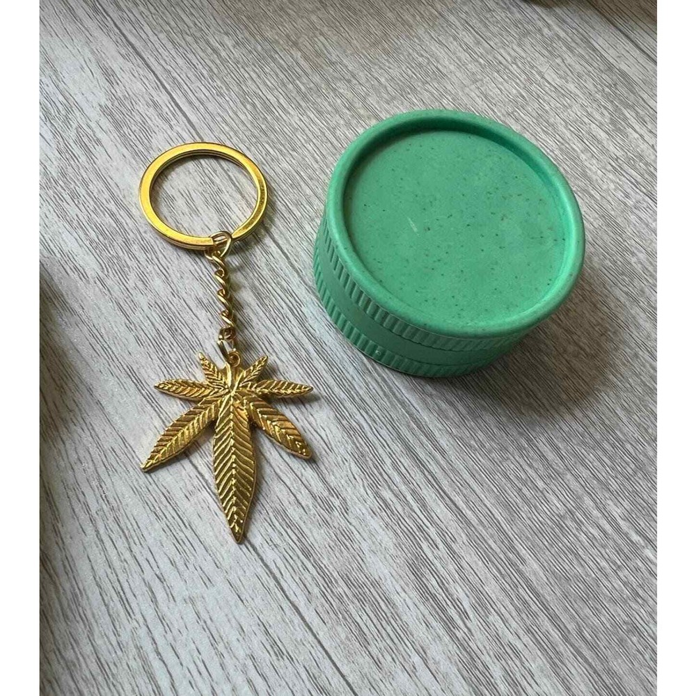 Leaf cosmetic bag with keychain and scrunchie.