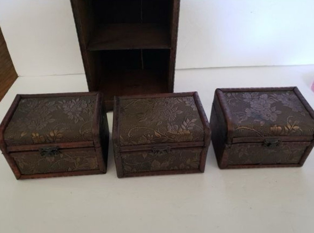 3 Small Storage Trunks in Shelving Unit