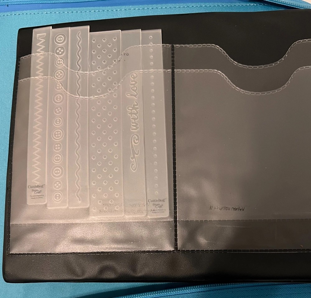 Cuttlebug Storage Binder + 42 Cutting and Embossing Folders + 7 Pouch Page Lot