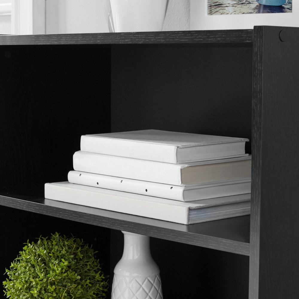 Sleek and sturdy closed back design 1 fixed and 2 adjustable shelves True black