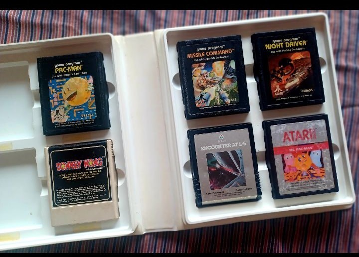 Vintage Atari 2600 Game lot with Atari Original storage cases, untested