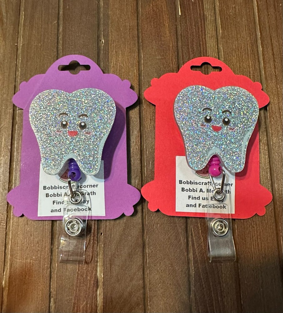 Tooth badge reels