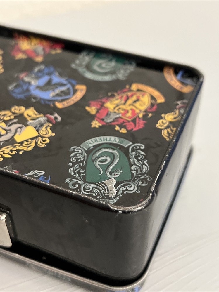 HOGWARTS CREST HOUSES HARRY POTTER TIN W/ HANDLE-SLIGHTLY DENTED (PRE-OWNED)